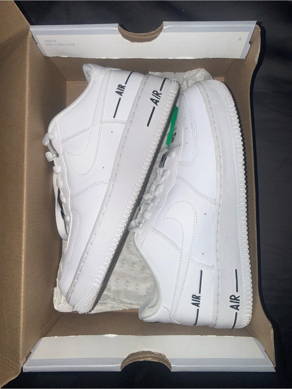 Nike White Low-Top Sneakers with Black AIR Accents